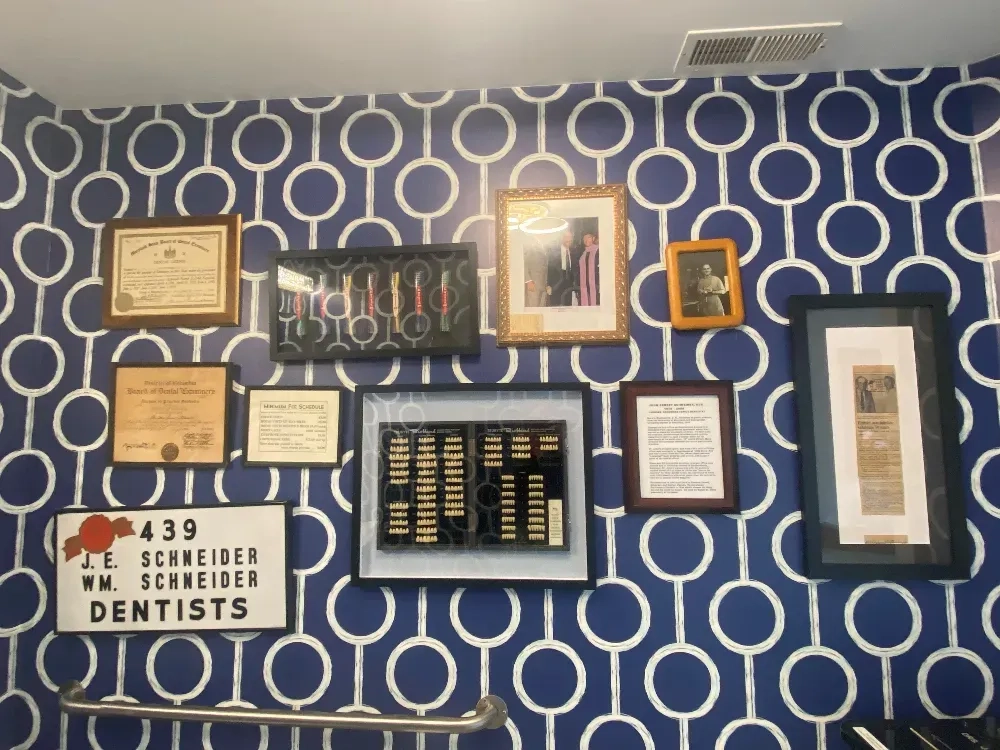 Schneider Family Dentistry memorabilia and certificates wall